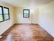Empty living room area with luxury vinyl plank flooring and abundant natural light at 5130 Navajo Ct, Columbus, IN 47203