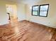 Bright, empty living room with luxury vinyl plank flooring and plenty of natural light at 5130 Navajo Ct, Columbus, IN 47203