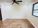 Well lit living room with ceiling fan and large windows at 5130 Navajo Ct, Columbus, IN 47203