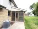 Exterior view of screened-in porch, showing access and integration with the home and backyard at 5130 Navajo Ct, Columbus, IN 47203