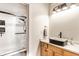 Modern bathroom with walk-in shower, sleek black hardware, and bright, minimalist design at 55 S Harding St # 308, Indianapolis, IN 46222