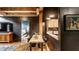 Open-concept space with dining area and kitchen view, showcasing modern loft living at 55 S Harding St # 308, Indianapolis, IN 46222