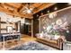 Open living space featuring hardwood floors, exposed beams, and a kitchen view at 55 S Harding St # 308, Indianapolis, IN 46222