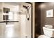 Sleek bathroom with a modern glass-enclosed shower and stylish black fixtures at 55 S Harding St # 308, Indianapolis, IN 46222