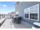 Stylish back deck with an outdoor table and chairs, adding to the home's outdoor living space at 5848 Sheffield Ln, Whitestown, IN 46075