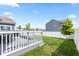 Outdoor deck with table, chairs, and fenced lawn, perfect for entertaining and outdoor enjoyment at 5848 Sheffield Ln, Whitestown, IN 46075