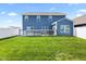A fully fenced backyard with a spacious deck and lush green grass, offering privacy and outdoor enjoyment at 5848 Sheffield Ln, Whitestown, IN 46075
