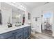 Bathroom featuring dual vanity, white countertops, and modern fixtures at 5848 Sheffield Ln, Whitestown, IN 46075