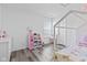 Inviting bedroom with a play kitchen, vanity, and cozy canopy bed at 5848 Sheffield Ln, Whitestown, IN 46075
