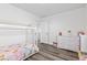 Bright and airy bedroom with a canopy bed, dresser, and ample natural light at 5848 Sheffield Ln, Whitestown, IN 46075
