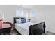 Well-lit bedroom with two windows, stylish furnishings, and modern decor at 5848 Sheffield Ln, Whitestown, IN 46075