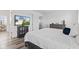 Bright bedroom featuring stylish gray furniture and wood-look floors at 5848 Sheffield Ln, Whitestown, IN 46075