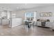 Cozy dining area with table set, built-in bar area, and view into a bright living space at 5848 Sheffield Ln, Whitestown, IN 46075