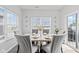 Dining room featuring a modern table with seating for six, natural light, and sliding glass door at 5848 Sheffield Ln, Whitestown, IN 46075