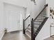 Bright foyer with hardwood floors, staircase, and a view of the front door at 5848 Sheffield Ln, Whitestown, IN 46075