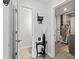 Hallway with a modern decor, stylish table, and convenient access to utility area and other rooms at 5848 Sheffield Ln, Whitestown, IN 46075