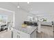 Bright kitchen with a center island, granite countertops, modern pendant lights, and stainless steel appliances at 5848 Sheffield Ln, Whitestown, IN 46075