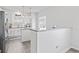 Modern kitchen featuring a white island with granite countertop and stainless steel appliances at 5848 Sheffield Ln, Whitestown, IN 46075