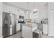 Modern kitchen with stainless appliances, granite counters, and central island with seating at 5848 Sheffield Ln, Whitestown, IN 46075