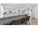 Open concept kitchen featuring bar stool seating, stainless steel appliances, and granite countertops at 5848 Sheffield Ln, Whitestown, IN 46075