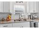 Kitchen sink with granite countertops, stainless steel appliances, and a window that offers natural light at 5848 Sheffield Ln, Whitestown, IN 46075