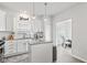 Bright kitchen with white cabinets, granite counters, and stainless steel appliances at 5848 Sheffield Ln, Whitestown, IN 46075