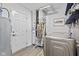 Efficient laundry room featuring modern appliances, ample storage, and a convenient laundry sign at 5848 Sheffield Ln, Whitestown, IN 46075