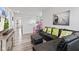 Inviting living room with a black sectional, media center, and a glimpse of the home's open layout at 5848 Sheffield Ln, Whitestown, IN 46075