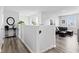 Bright living area showcasing a black leather sofa and neutral décor at 5848 Sheffield Ln, Whitestown, IN 46075