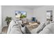 Cozy living room with plush gray sofa, area rug, and a media center for relaxation at 5848 Sheffield Ln, Whitestown, IN 46075