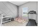 Versatile spare room with gray accent wall, window, and exercise equipment at 5848 Sheffield Ln, Whitestown, IN 46075