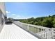 Spacious deck featuring railing, view of lake and nearby greenery, and outdoor furniture at 6110 Pelican Ln, Columbus, IN 47201