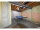 Spacious basement featuring unfinished walls, exposed ceiling and blue ping pong table at 6110 Pelican Ln, Columbus, IN 47201