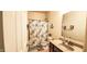 Cozy bathroom with vanity, mirror, and floral shower curtain at 6110 Pelican Ln, Columbus, IN 47201