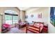 Bright, carpeted bedroom with large window and two twin beds at 6110 Pelican Ln, Columbus, IN 47201