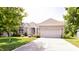 Lovely single-story home featuring a well-manicured lawn and wide driveway at 6110 Pelican Ln, Columbus, IN 47201