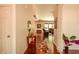 Bright hallway leads to a living room area with hardwood flooring at 6110 Pelican Ln, Columbus, IN 47201