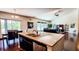 Open kitchen showcasing granite countertops, stainless steel appliances, and seamless flow into the living area at 6110 Pelican Ln, Columbus, IN 47201