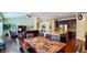 Spacious living room showing hardwood floors, open concept layout with eat-in kitchen and dining area at 6110 Pelican Ln, Columbus, IN 47201