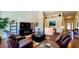 Open-concept living room with high ceilings and sleek leather furniture at 6110 Pelican Ln, Columbus, IN 47201