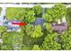 Aerial view of property with mature trees, large backyard, and neighborhood surroundings at 6115 E 65Th Pl, Indianapolis, IN 46220