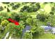 A captivating aerial view showcases the lush greenery surrounding this charming home and adjacent golf course at 6115 E 65Th Pl, Indianapolis, IN 46220