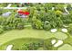 Beautiful aerial view of a home with lush landscaping located adjacent to a well maintained golf course at 6115 E 65Th Pl, Indianapolis, IN 46220