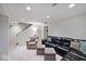Spacious basement living area with comfortable seating, plush carpet, and recessed lighting at 6115 E 65Th Pl, Indianapolis, IN 46220