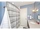 Updated bathroom featuring a shower with a gray and white shower curtain at 6115 E 65Th Pl, Indianapolis, IN 46220