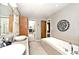 Bright bathroom with double sinks, soaking tub and lots of storage space at 6115 E 65Th Pl, Indianapolis, IN 46220