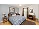 Cozy bedroom featuring a comfortable bed, soft lighting, and a decorative area rug at 6115 E 65Th Pl, Indianapolis, IN 46220