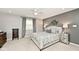 Serene bedroom with gray accent wall, carpet flooring, and ceiling fan at 6115 E 65Th Pl, Indianapolis, IN 46220