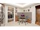 Cozy breakfast nook with built-in seating and a view into the dining room at 6115 E 65Th Pl, Indianapolis, IN 46220