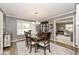 Elegant dining room featuring hardwood floors, a bay window, and stylish chandelier at 6115 E 65Th Pl, Indianapolis, IN 46220